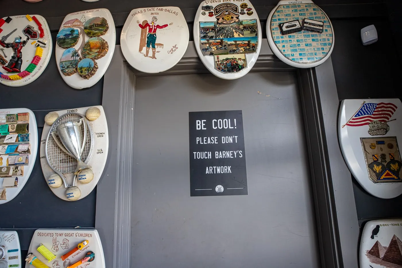 Be Cool Don't Touch Barney's Artwork sign - Barney Smith's Toilet Seat Art Museum in The Colony, Texas at The Truck Yard Bar