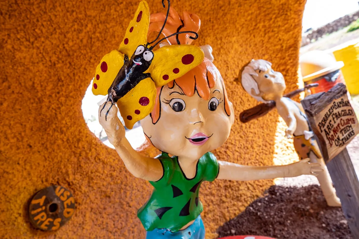 Pebbles Statue at Flintstones Bedrock City in Williams, Arizona - Arizona Roadside Attraction