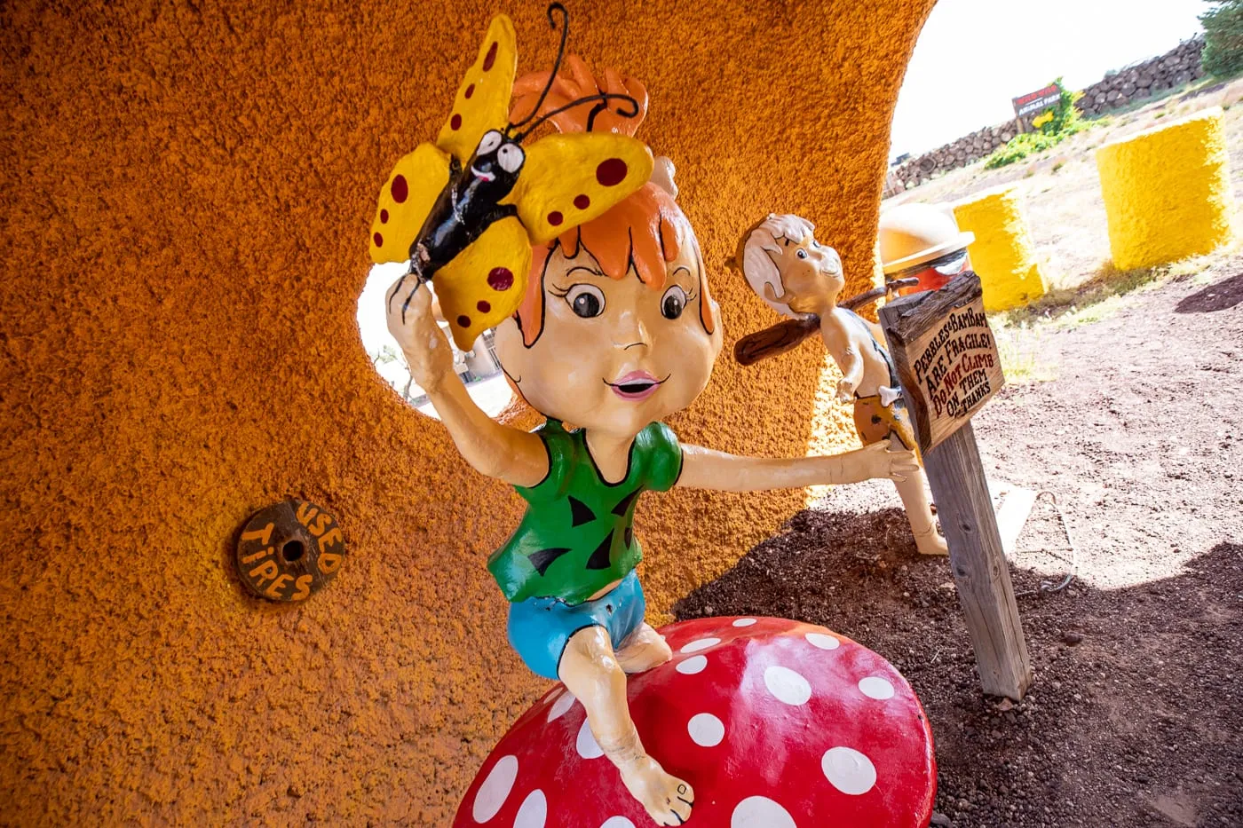 Pebbles Statue at Flintstones Bedrock City in Williams, Arizona - Arizona Roadside Attraction