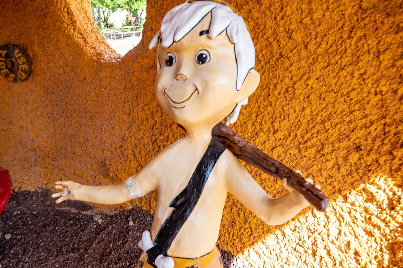 Bamm-Bamm Statue at Flintstones Bedrock City in Williams, Arizona - Arizona Roadside Attraction