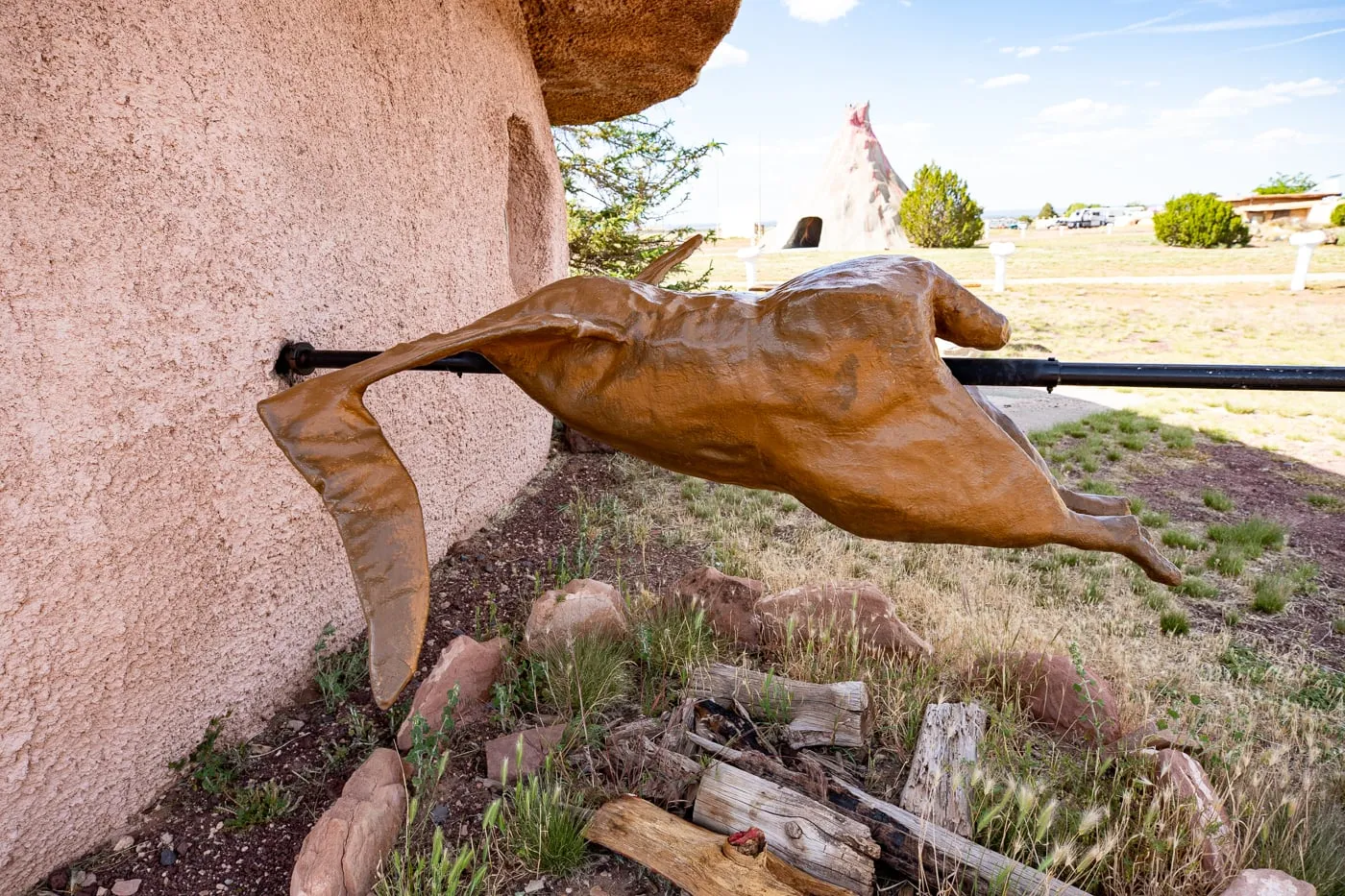 Pterosaur dinosaur roasting on a spit at the Grocery Store at Flintstones Bedrock City in Williams, Arizona - Arizona Roadside Attraction