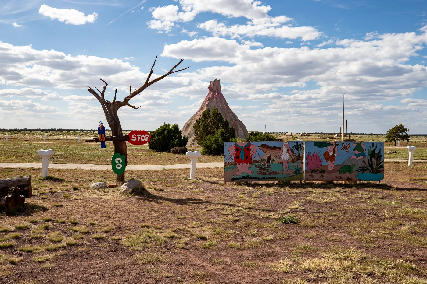 Flintstone character photo op and volcano at Flintstones Bedrock City in Williams, Arizona