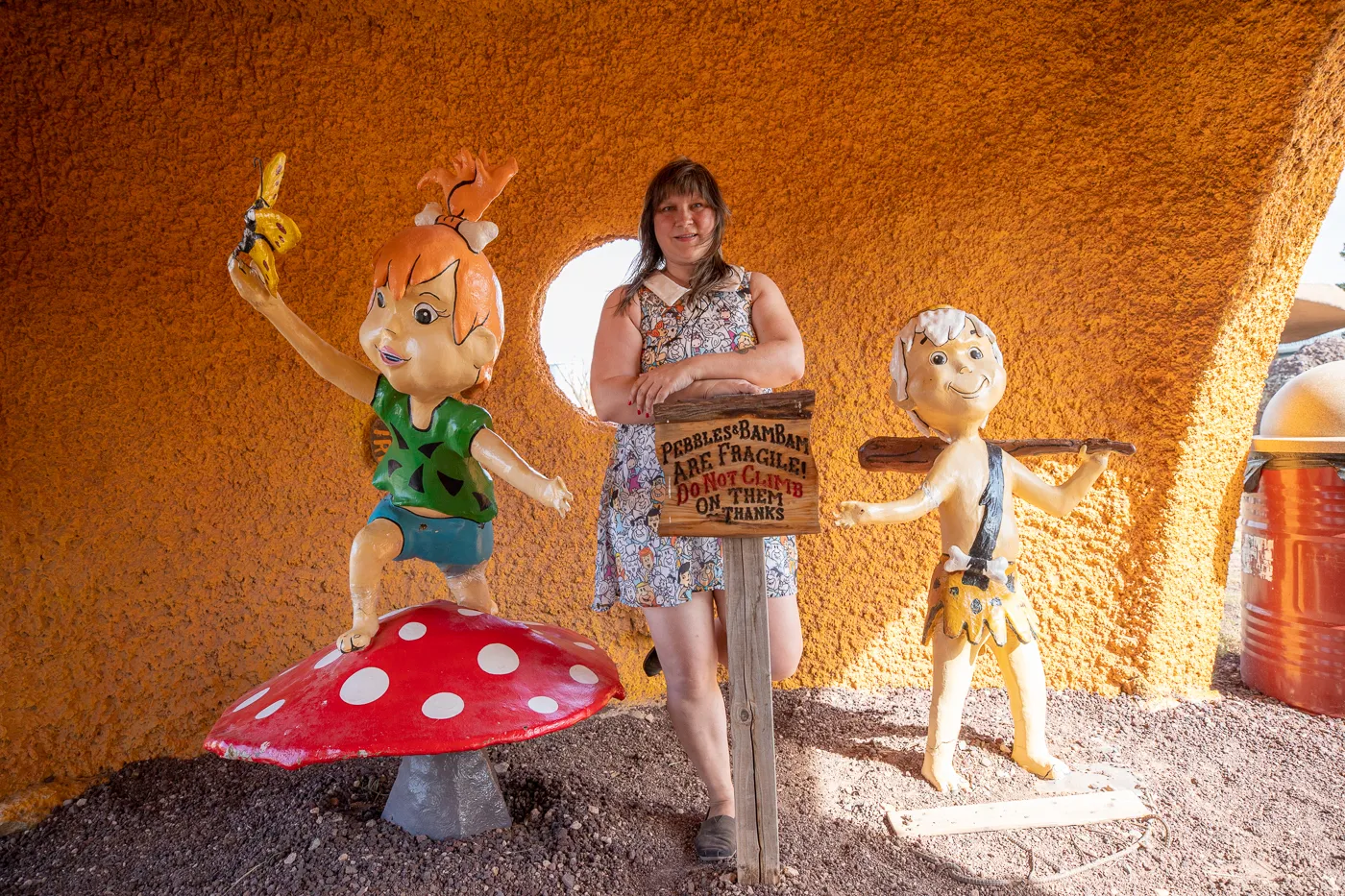 Pebbles and Bamm-Bamm Statues at Flintstones Bedrock City in Williams, Arizona - Arizona Roadside Attraction