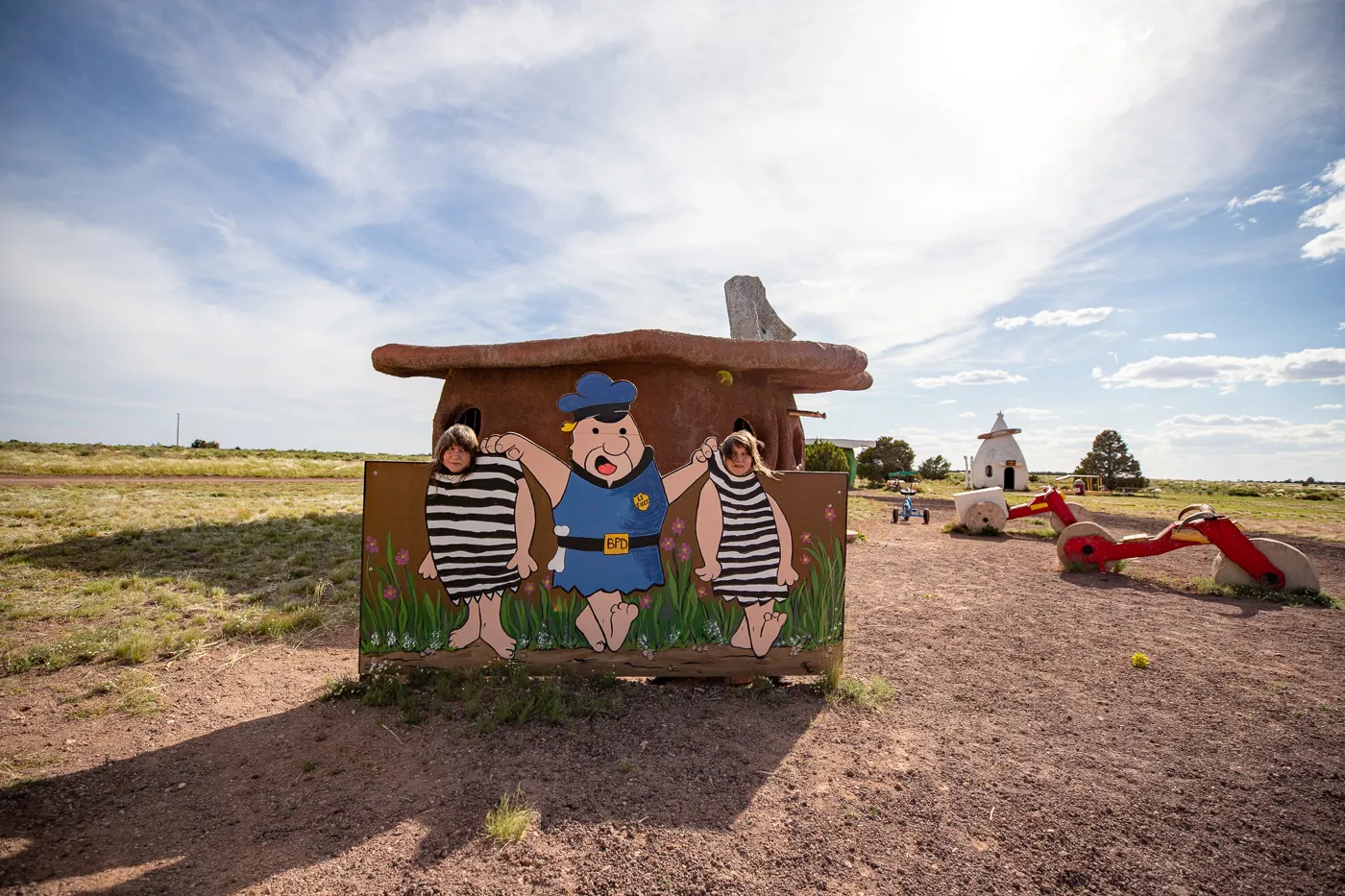 Getting arrested photo op at the Bedrock City Jail at Flintstones Bedrock City in Williams, Arizona