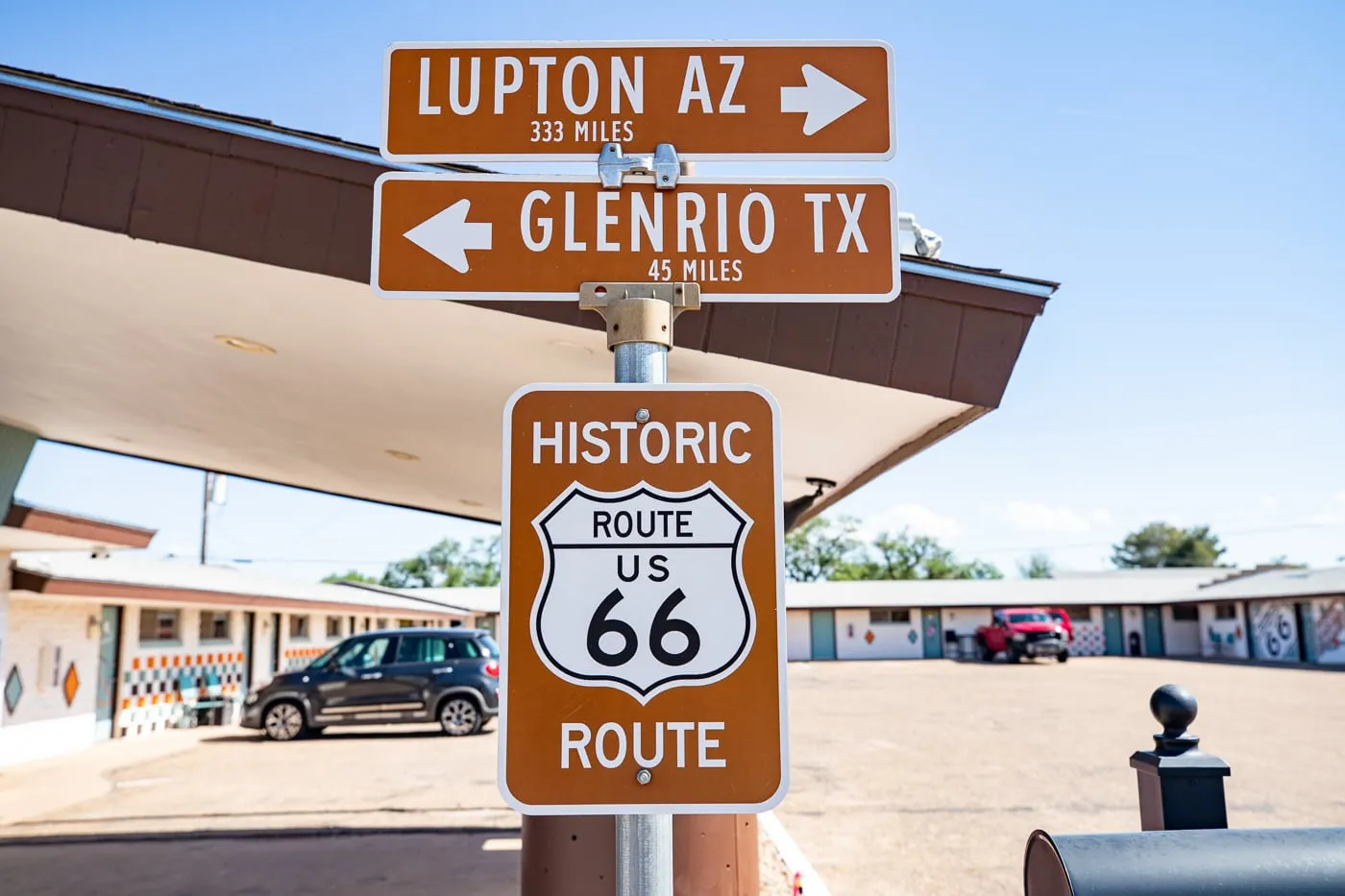 Historic Route 66 sign with arrows to Glenrio Texas and Lupton Arizona at Motel Safari in Tucumcari, New Mexico (Route 66 Motel)
