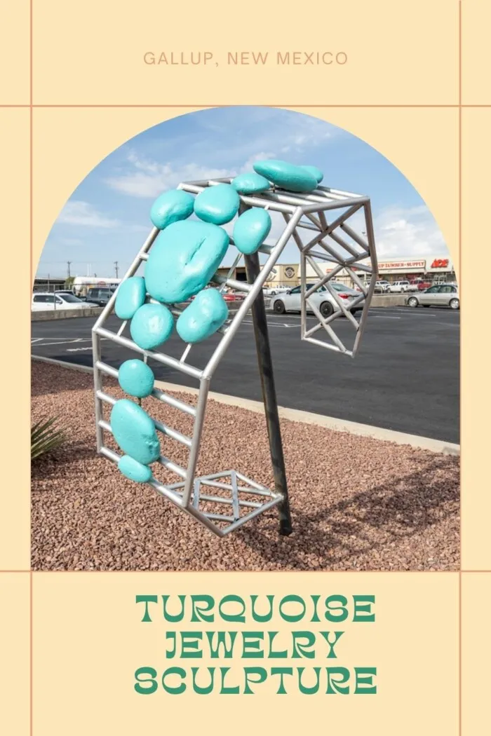 Find this Giant Turquoise Jewelry Sculpture at Perry Null Trading Company in Gallup, New Mexico. The giant turquoise bracelet is found in front of Perry Null Trading Company, a shop in Gallup, New Mexico that sells Native American jewelry, arts, and crafts. They specialize in silver and turquoise jewelry, pottery, carvings, and rugs. Visit on a Route 66 road trip through New Mexico and add this fun roadside attraction to your travel itinerary! #Route66 #RoadTrip #RoadsideAttraction #NewMexico