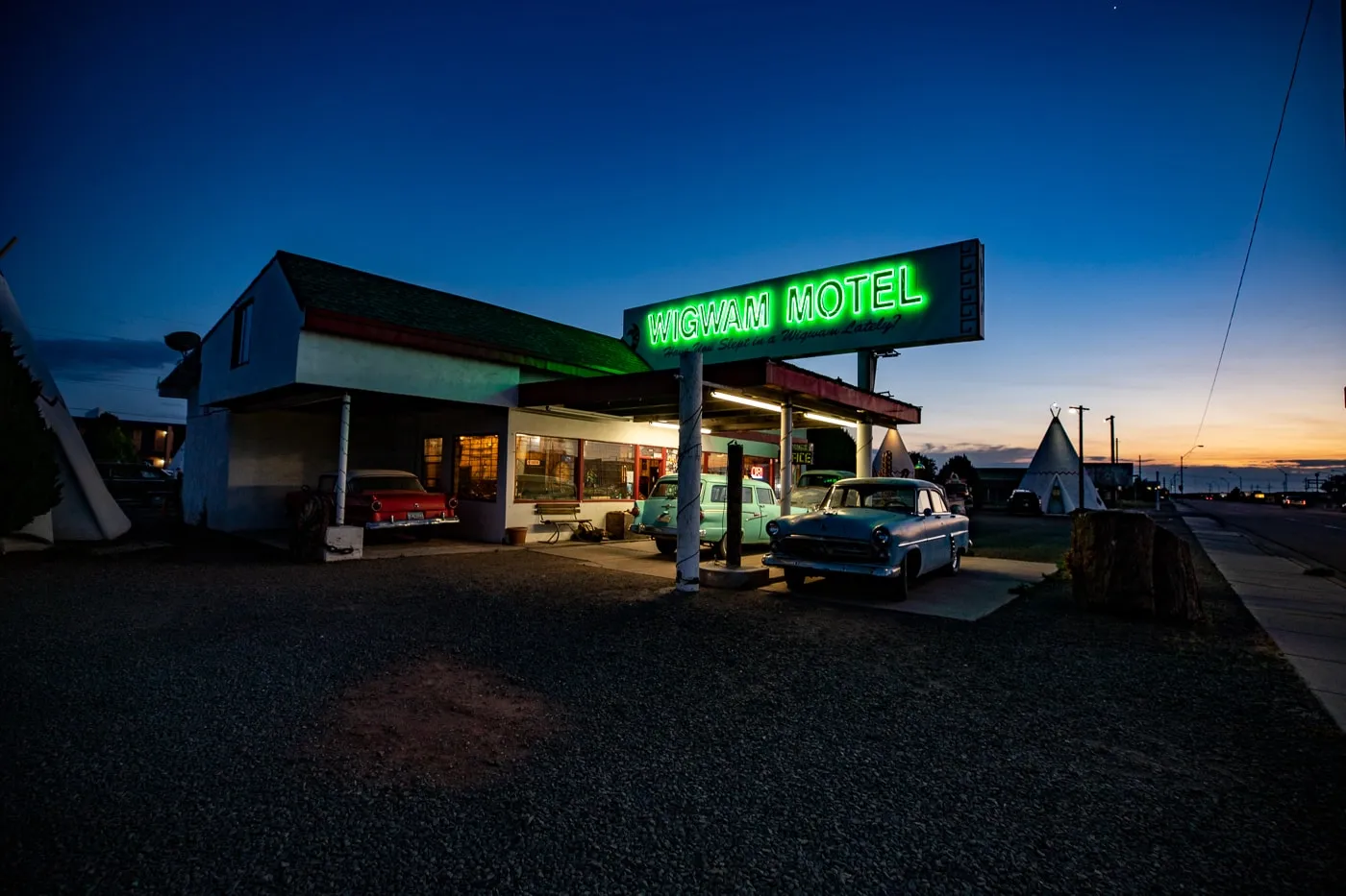 Reception building with lit up neon sign at Wigwam Motel in Holbrook, Arizona - Route 66 Motel - Wigwam Village Motel #6
