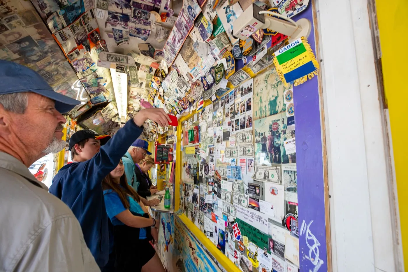 Walls covered with notes and money inside Delgadillo’s Snow Cap in Seligman, Arizona - Route 66 restaurant and Drive-In Diner