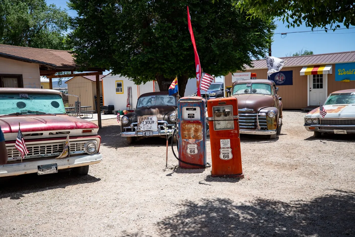 Old fuel pumps and cars at Delgadillo’s Snow Cap in Seligman, Arizona - Route 66 restaurant and Drive-In Diner