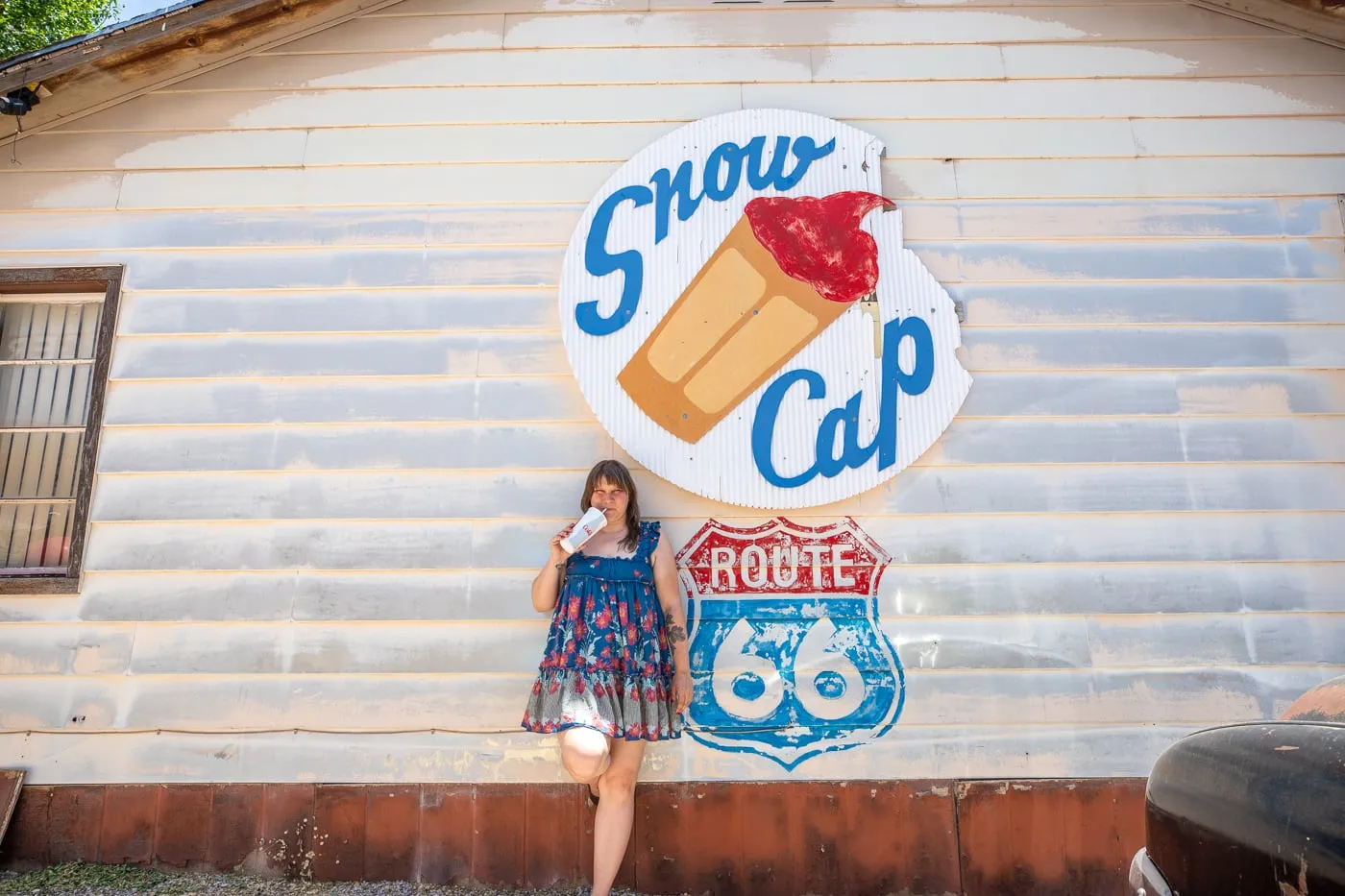 Drinking a milkshake at the Snow Cap Route 66 Mural at Delgadillo’s Snow Cap in Seligman, Arizona - Route 66 restaurant and Drive-In Diner