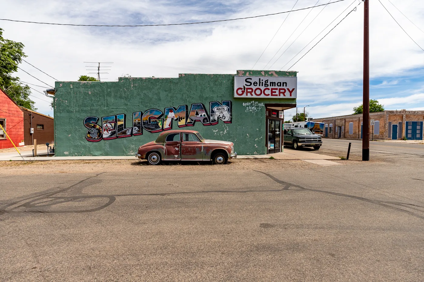 Seligman Grocery Mural on Arizona Route 66 - Green postcard mural in Seligman, Arizona