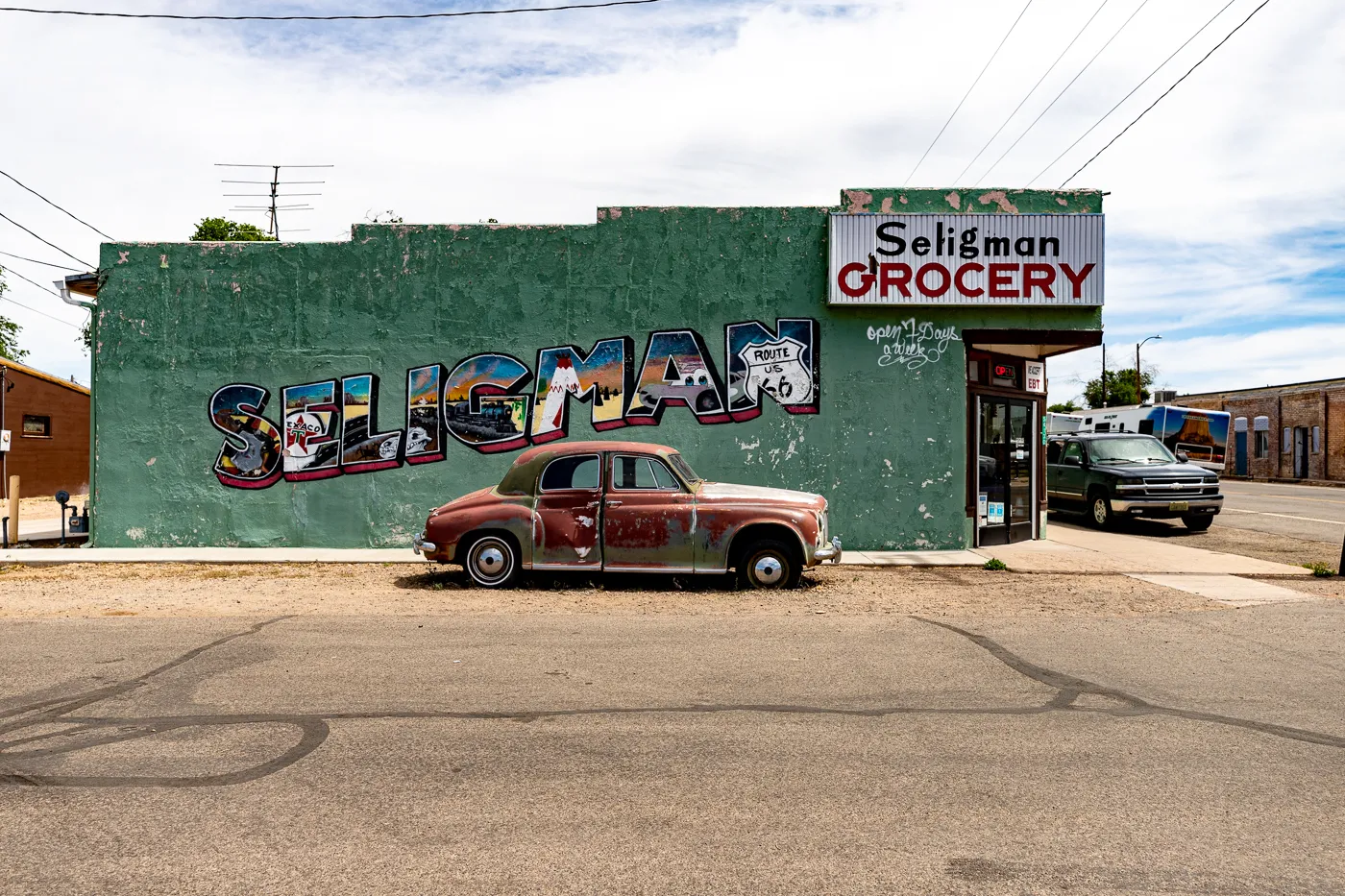 Seligman Grocery Mural on Arizona Route 66 - Green postcard mural in Seligman, Arizona