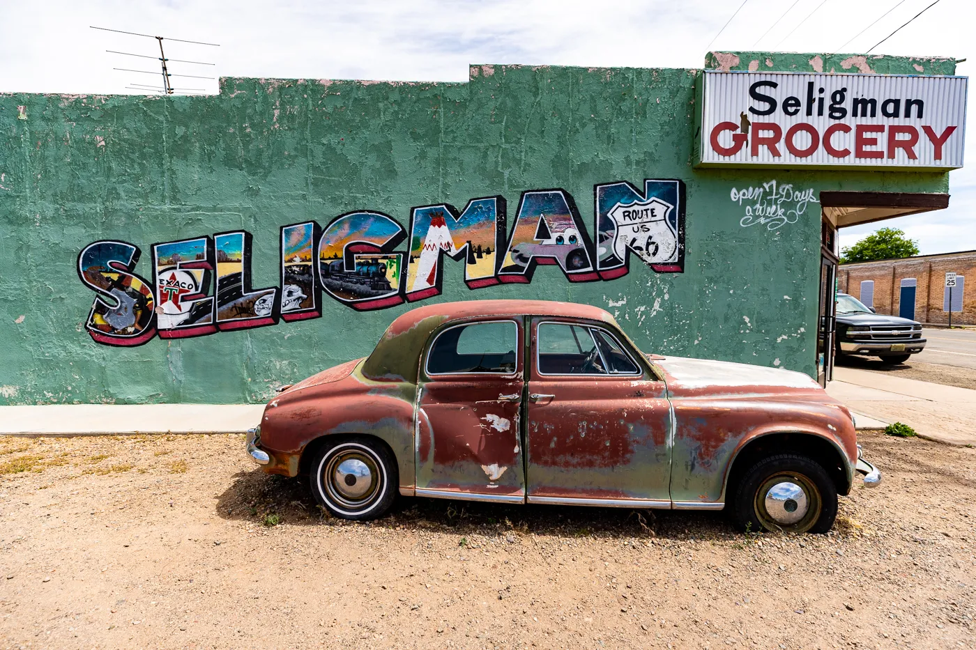 Seligman Grocery Mural on Arizona Route 66 - Green postcard mural in Seligman, Arizona