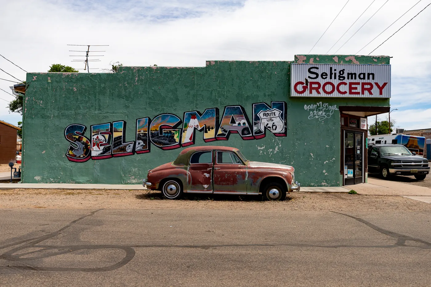 Seligman Grocery Mural on Arizona Route 66 - Green postcard mural in Seligman, Arizona