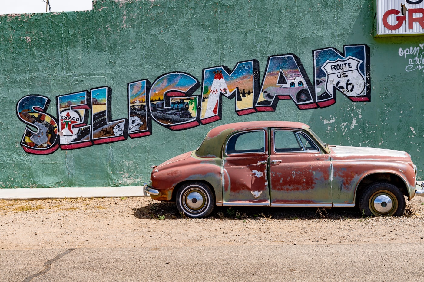 Seligman Grocery Mural on Arizona Route 66 - Green postcard mural in Seligman, Arizona