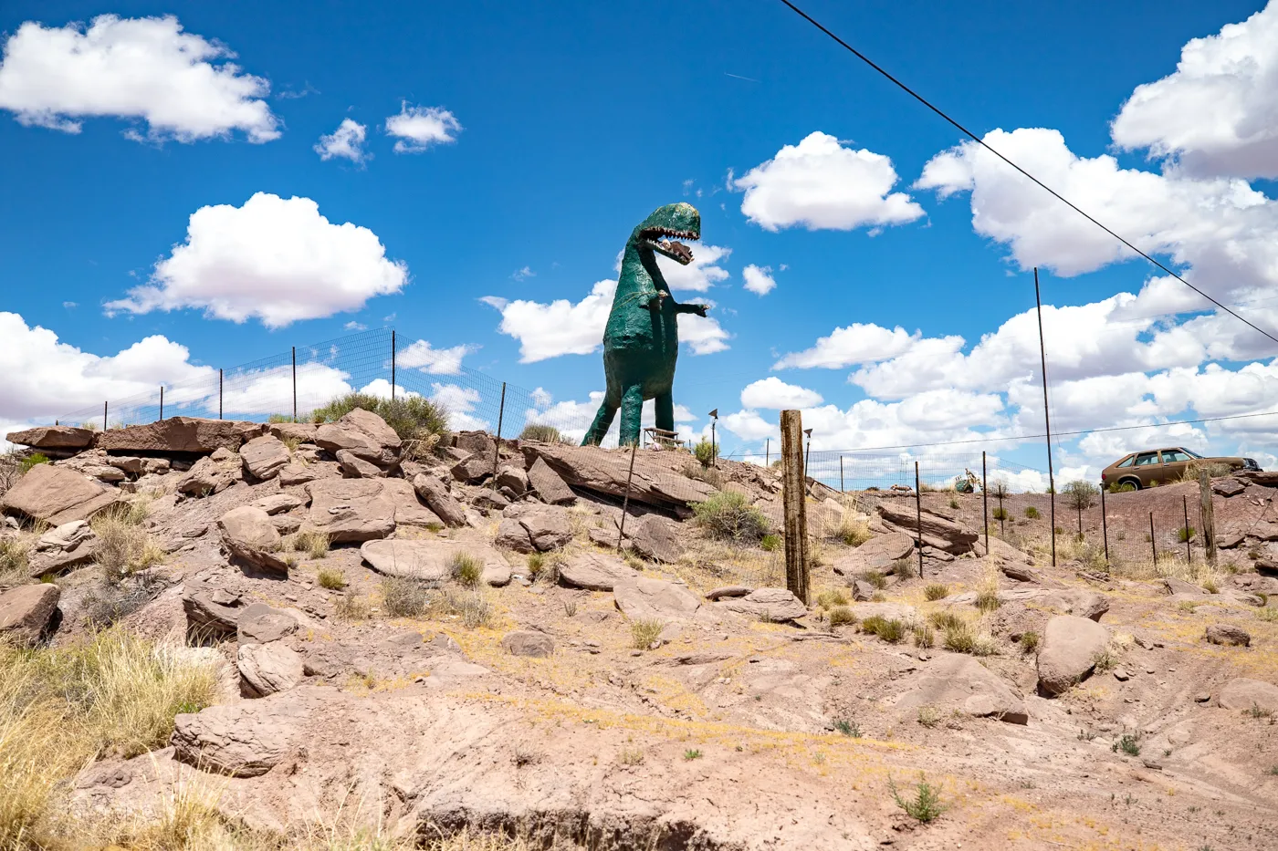 Giant dinosaur eating a woman at Stewart's Petrified Wood in Holbrook, Arizona Route 66 Roadside Attraction