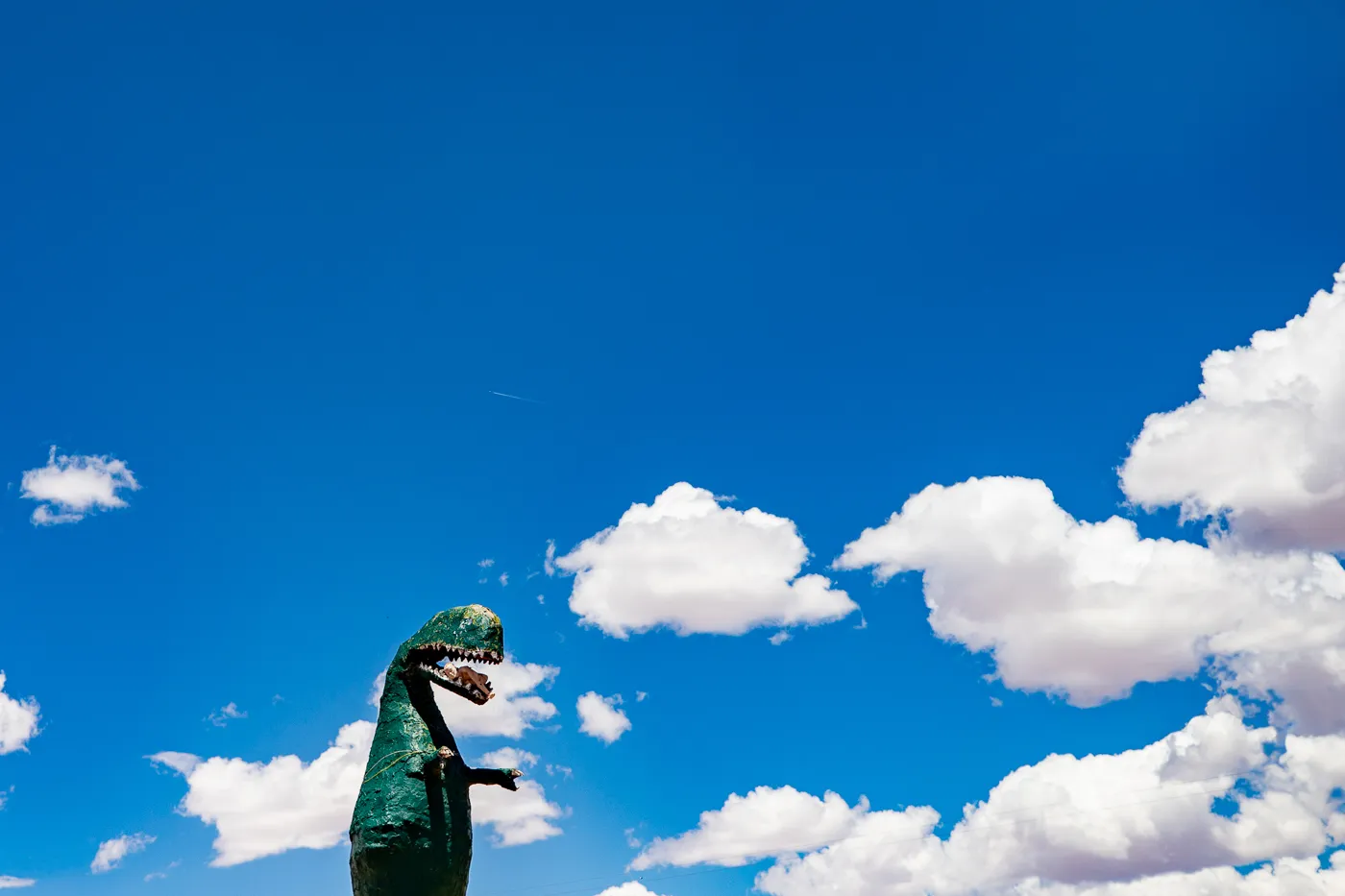 Giant dinosaur eating a woman at Stewart's Petrified Wood in Holbrook, Arizona Route 66 Roadside Attraction