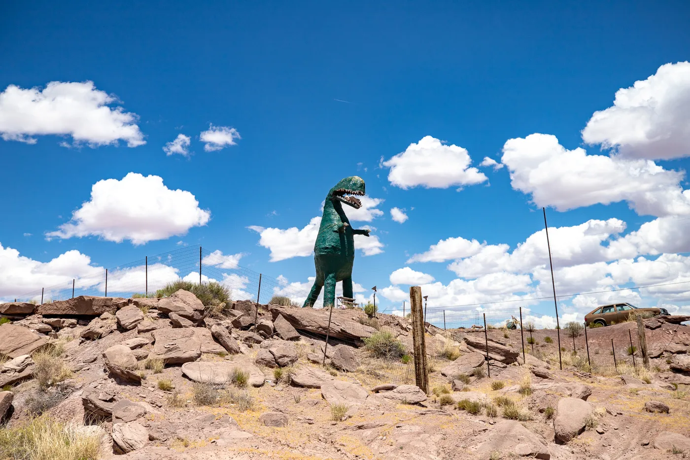 Giant dinosaur eating a woman at Stewart's Petrified Wood in Holbrook, Arizona Route 66 Roadside Attraction