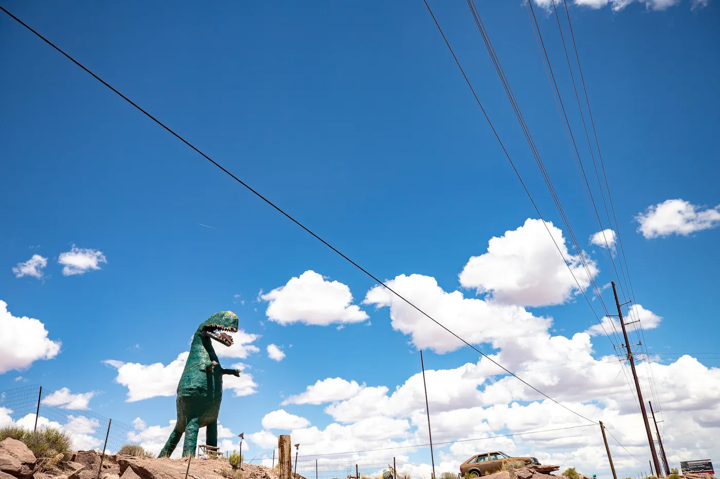 Giant dinosaur eating a woman at Stewart's Petrified Wood in Holbrook, Arizona Route 66 Roadside Attraction