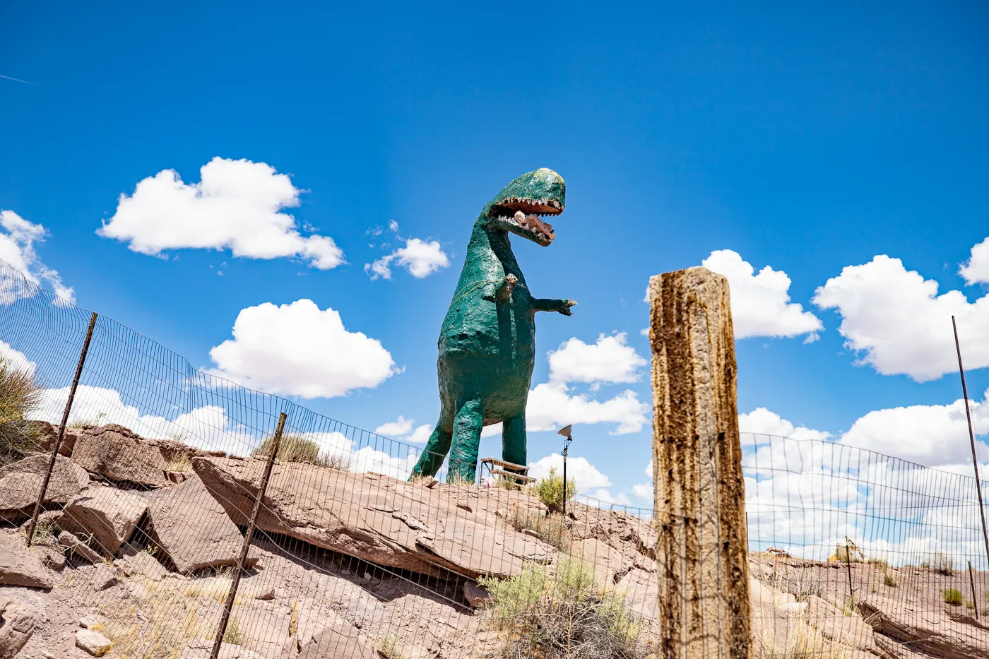 Giant dinosaur eating a woman at Stewart's Petrified Wood in Holbrook, Arizona Route 66 Roadside Attraction